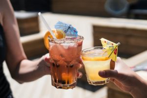 Friends cheering their drinks together.