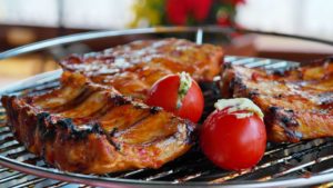 Barbecue ribs and tomatoes. 