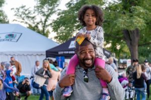 Father and daughter enjoying a parade