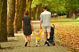 A family taking a walk.