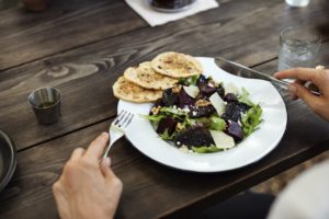 A bowl of salad on a table.