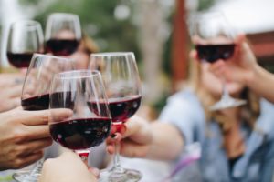 A group of people drinking wine