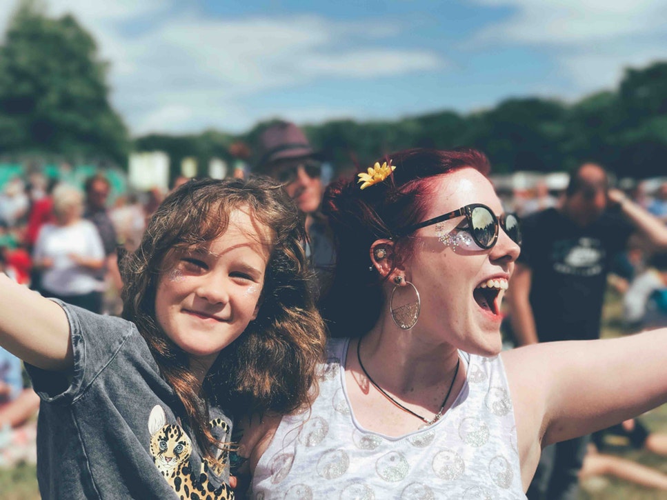 A woman and a girl at a festival.