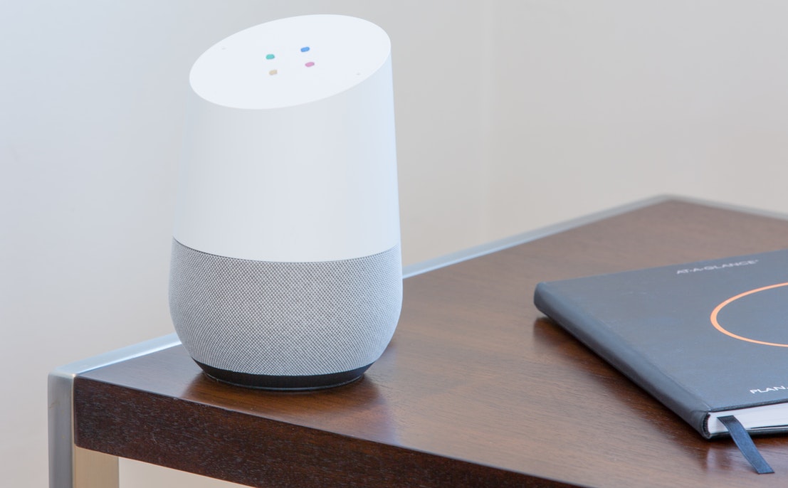 A smart home speaker on a table.