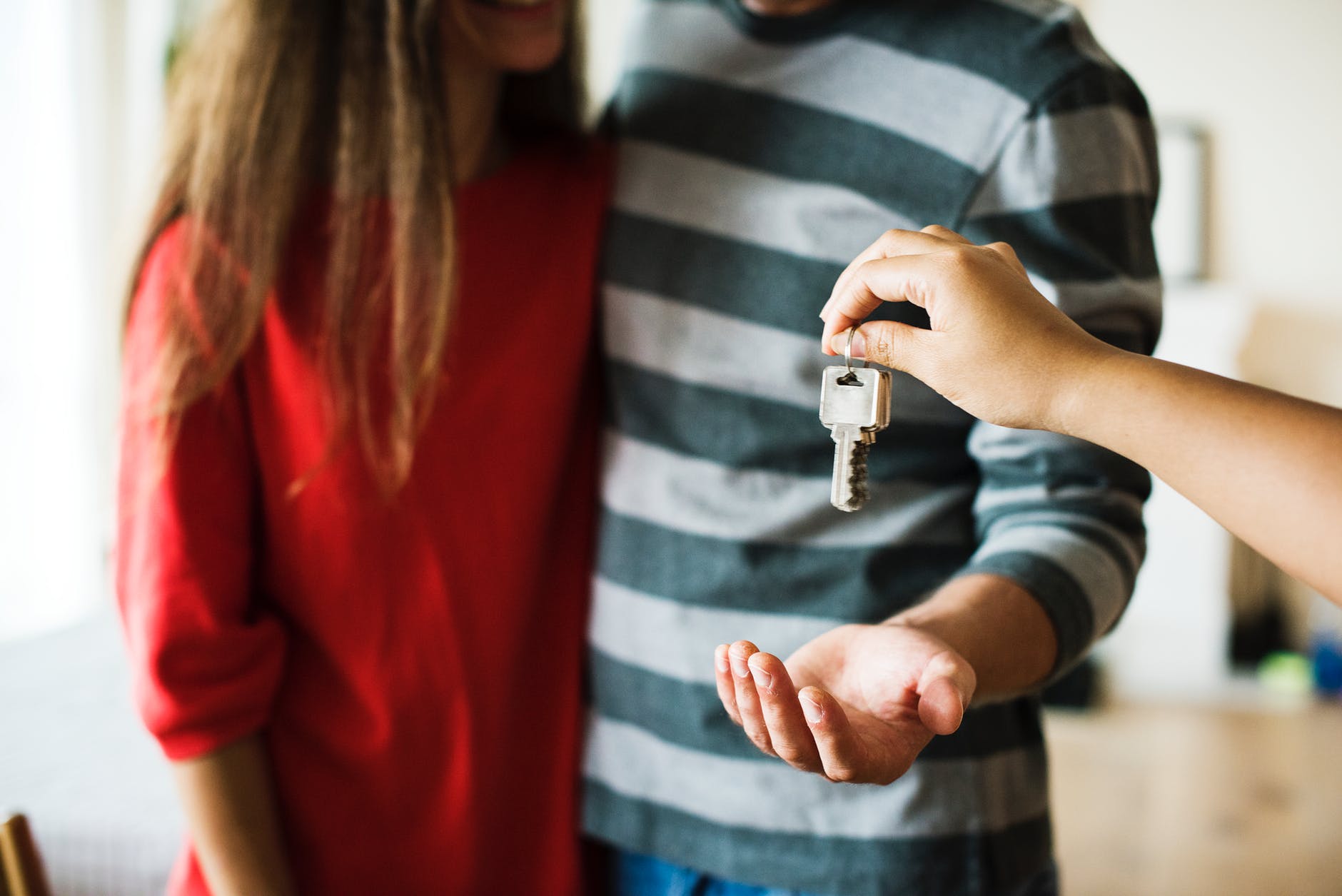 People getting the keys to a house. 