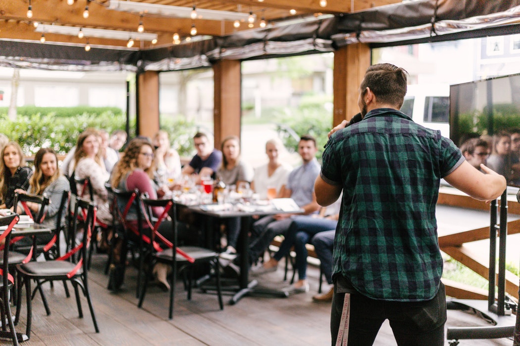 People at an event on a patio.