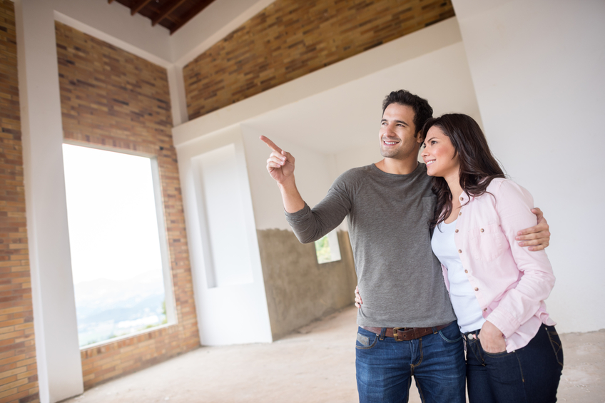 A couple touring a home. 