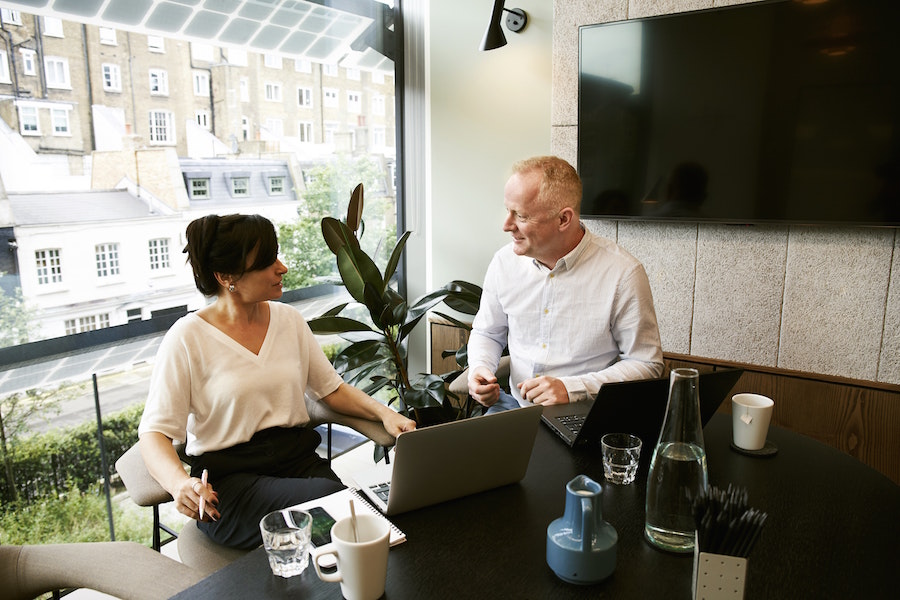 Man and woman discussing real estate resolutions