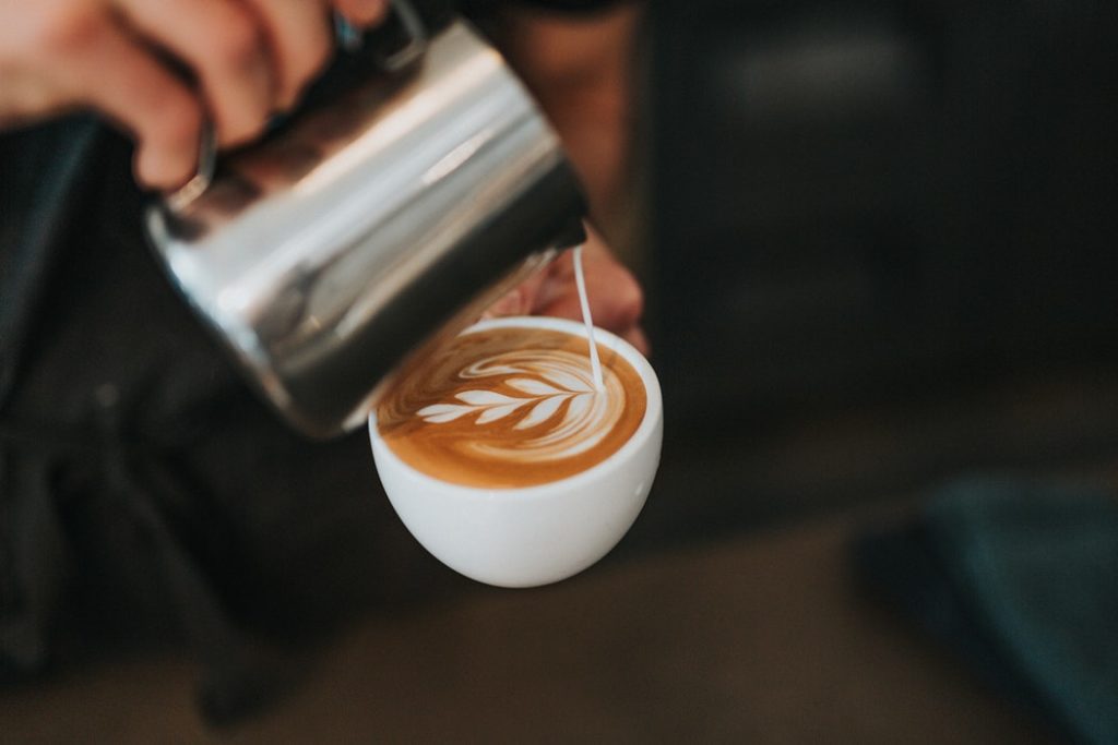 A person making coffee at one of the new Fort Worth restaurants.