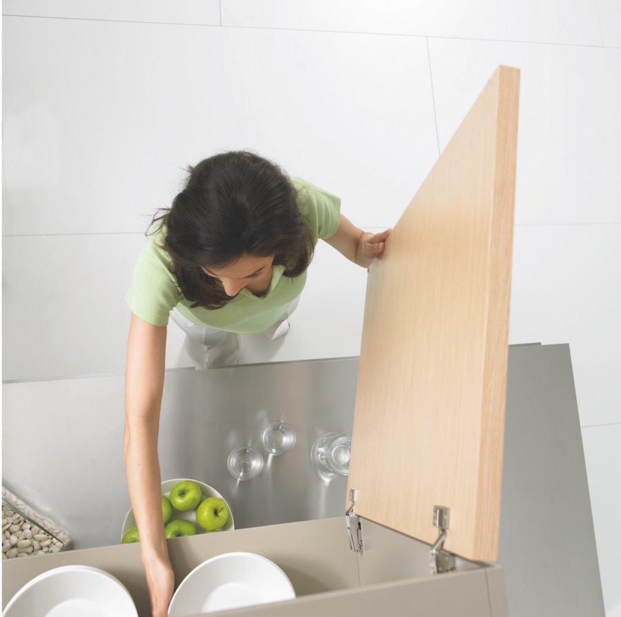 Woman maximizing space in a cabinet